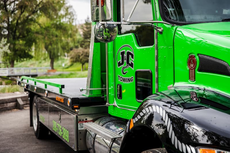 j and c towing flatbed towing truck